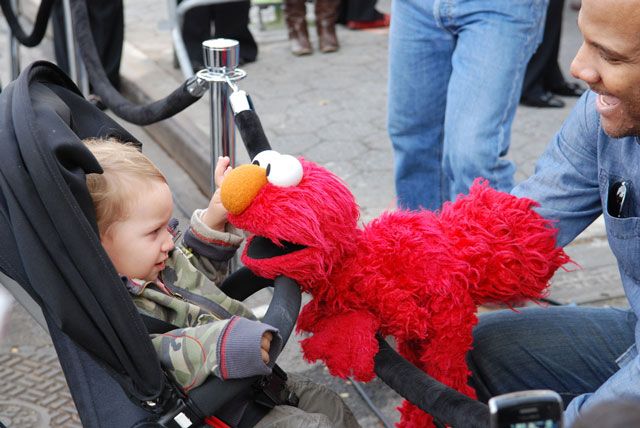 Elmo and little Sesame Street fan